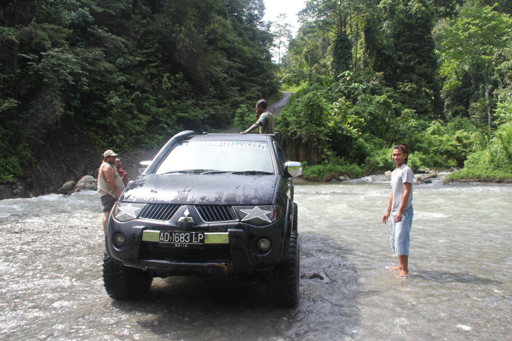 Cleaning the truck in the river